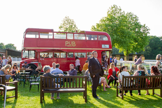 bus bar with a crowd of people around it