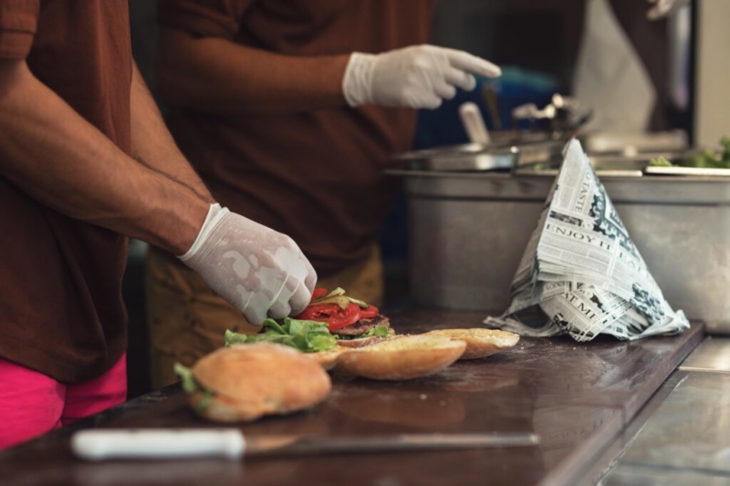 team preparing burgers