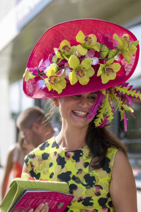 lady in pink and yellow hat